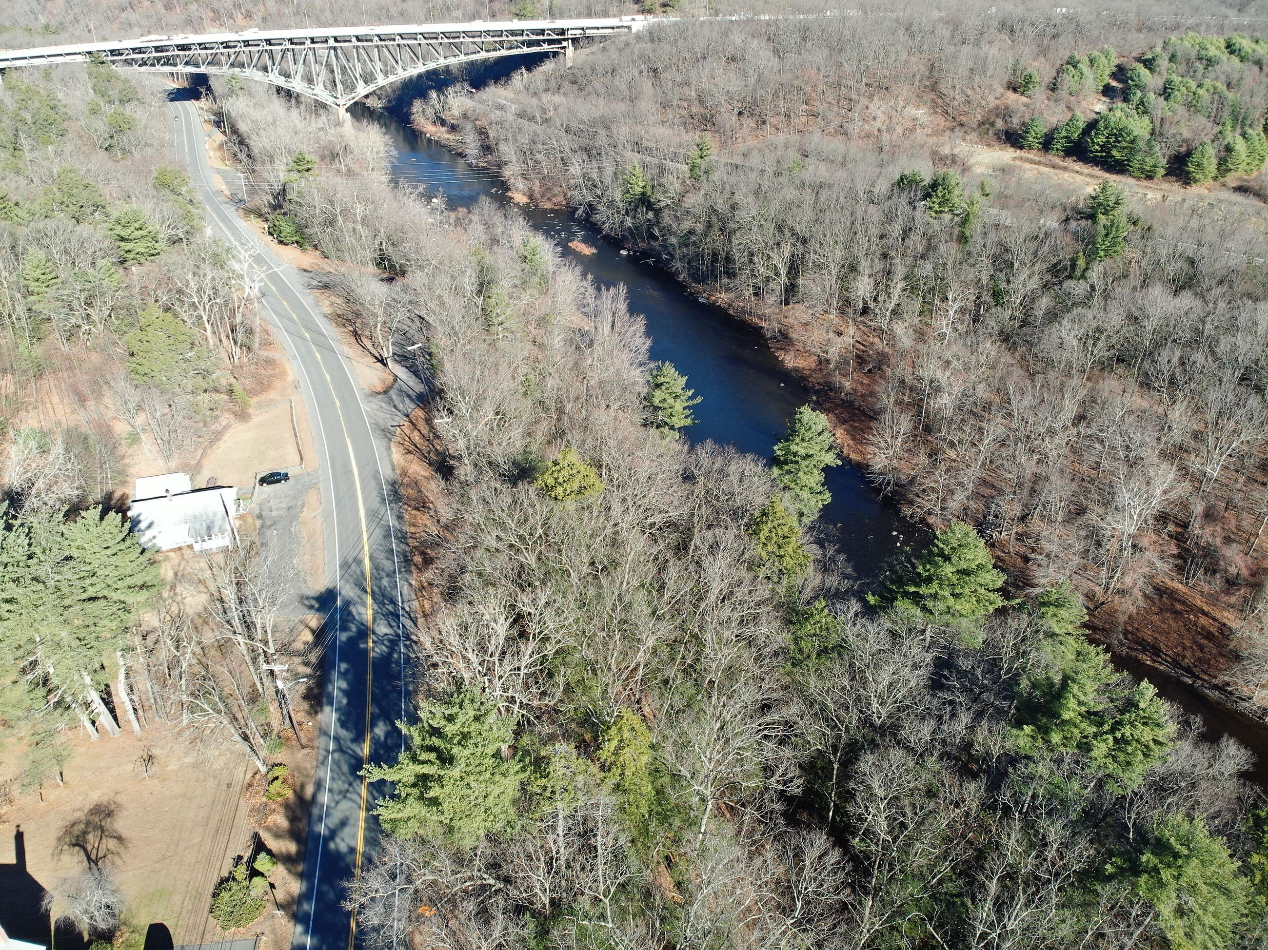 Tekoa Narrows Conservation Area in the fall with the Westfield River, Route 20, and I-90 bridge.