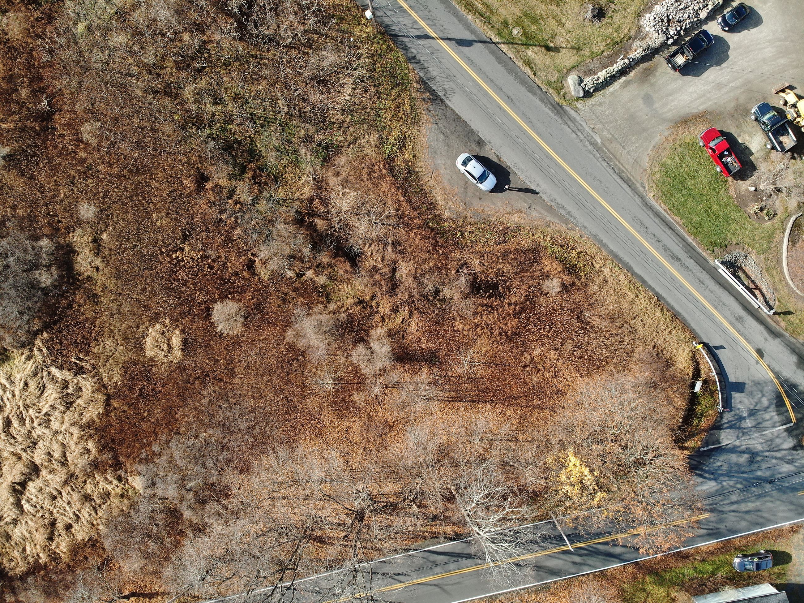The intersection of Wyben and Montgomery Road, from the air in the fall. The small parking area can be seen, along with the wetland located adjacent to it.