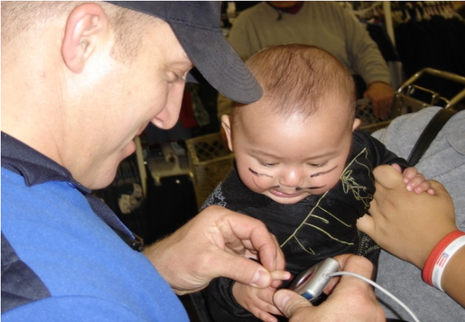 Child Being Finger Printed