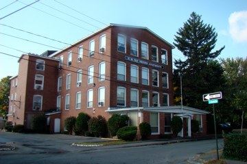 Photo of the front of the Van Deusen Whip factory.