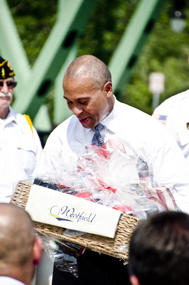Governor Deval Patrick looks at a gift basket